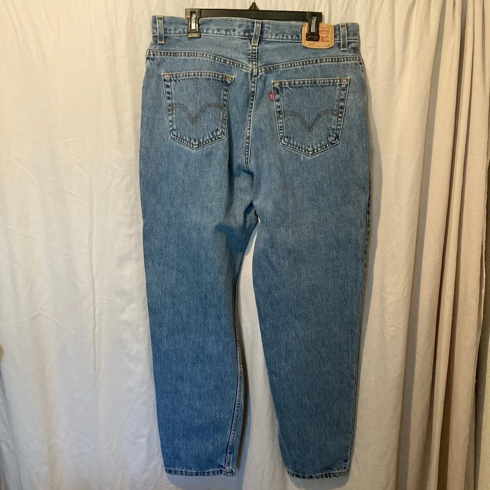 Vintage Levis 550 Classic Relaxed Tapered Jeans Medium Wash Blue Denim 16M y2k